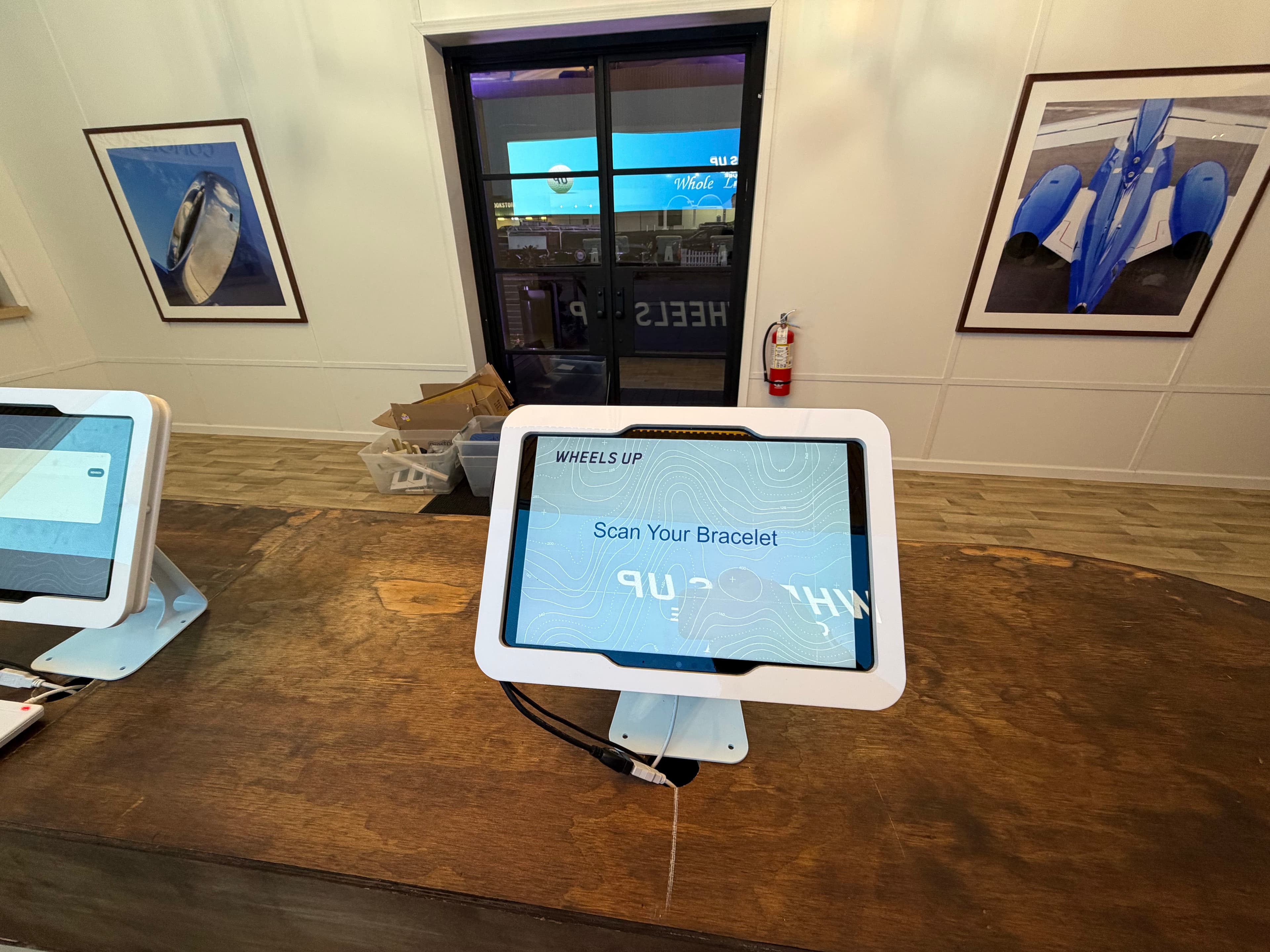 Guest scanning a custom RFID credential at a Wheels Up activation
