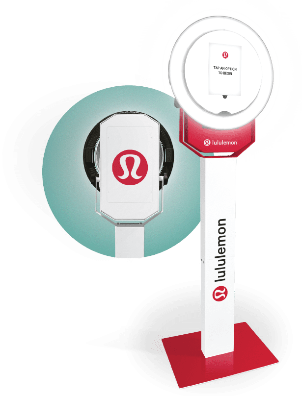 The Selfie Station branded photo booth: a ring-light kiosk with a full-wrap column, shown from the front and the back